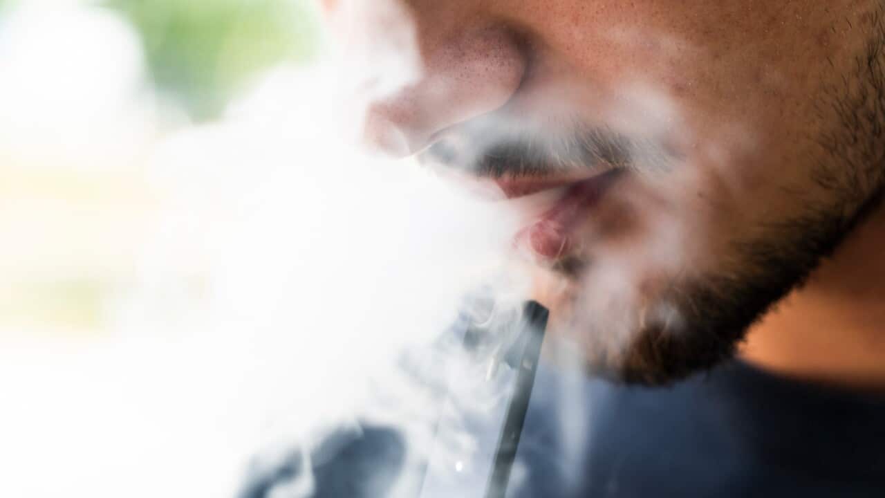 Man smoking e-cigarette
