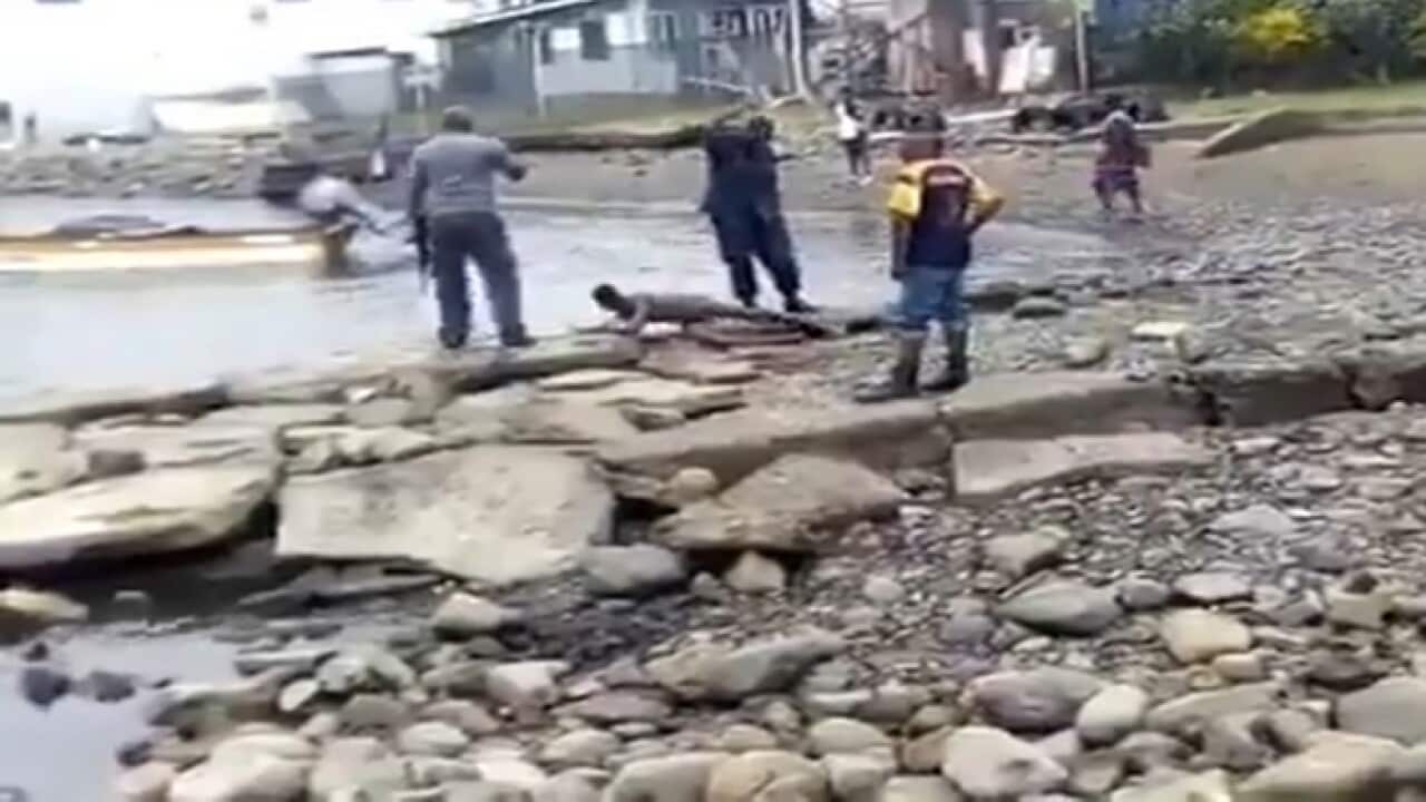 Image from the video purporting to show PNG police beating the boy