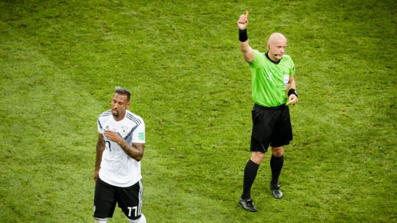Szymon Marciniak gives a Red Card to Jerome Boateng during Sweden Vs Germany