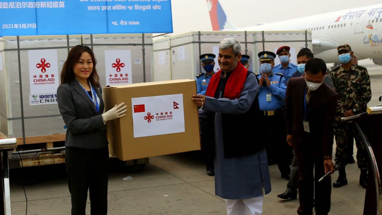 Chinese ambassador Hou Yanqi handing over 8 lakh doses of doses of COVID-19 vaccines to Nepal on Monday.