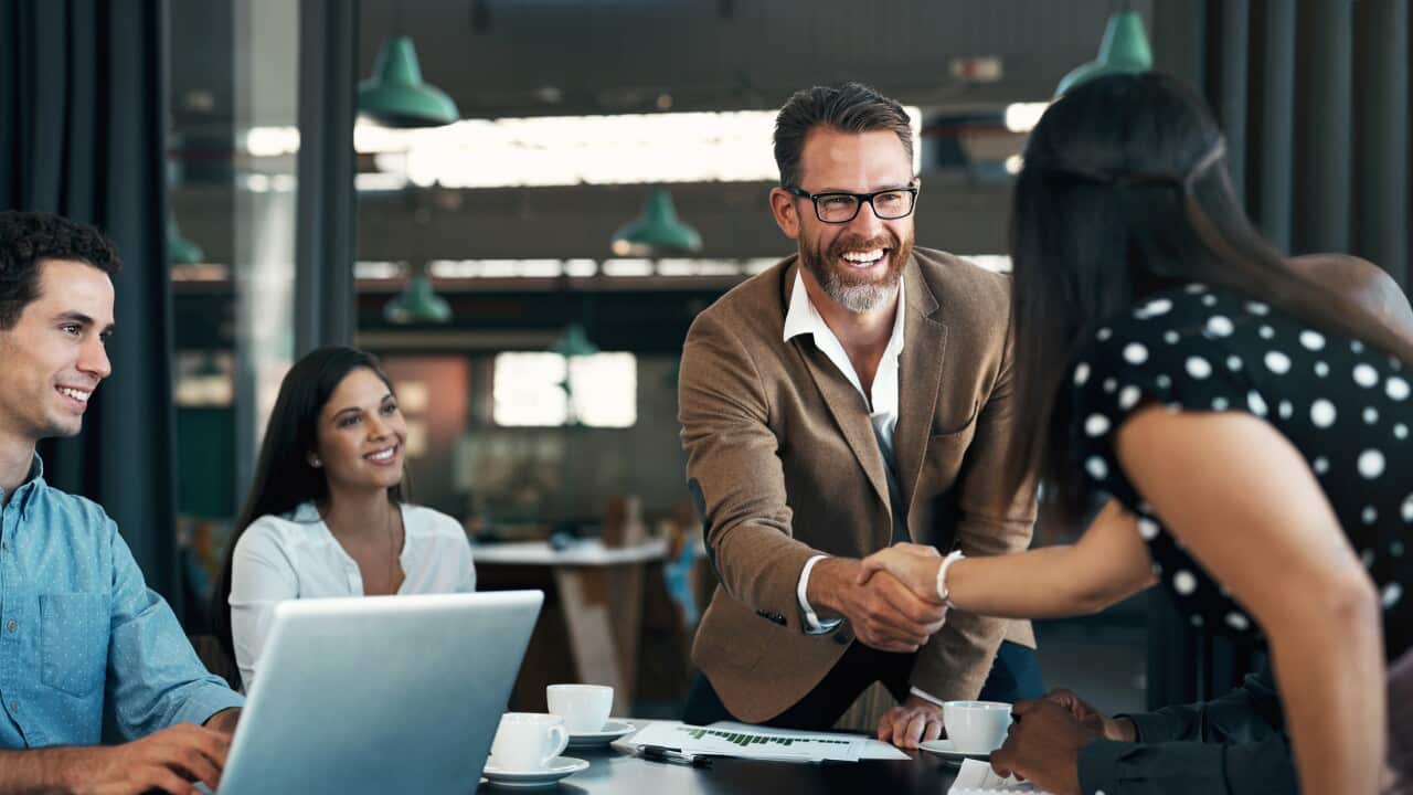 Business people meeting and handshake for partnership, b2b contract deal or woman inclusion promotion. Corporate team, manager shaking hands in office for commitment, onboarding or client negotiation