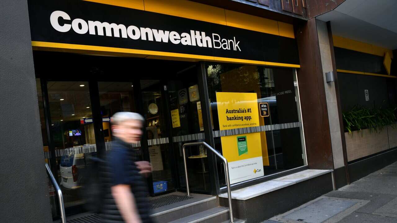 A pedestrian at the Commonwealth bank (AAP).