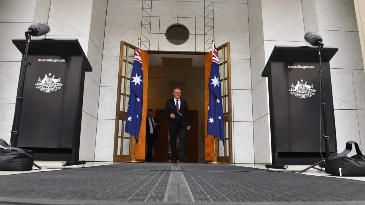 Prime Minister Scott Morrison arrives at a press conference at Parliament House in Canberra. Wednesday, April 7, 2021. (AAP Image/Mick Tsikas) NO ARCHIVING