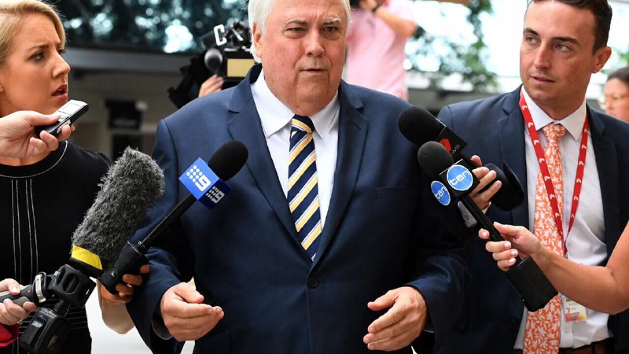 Clive Palmer arrives at the Federal Court in Brisbane