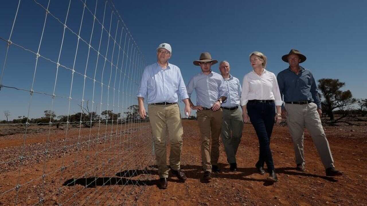 Prime Minister Scott Morrison with colleagues in Quilpe.