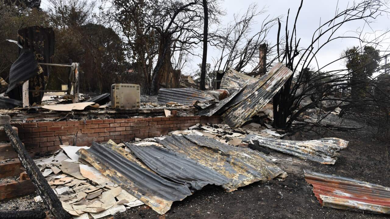 The burnt out remains of a house are seen from a bushfire in the NSW Southern Highlands