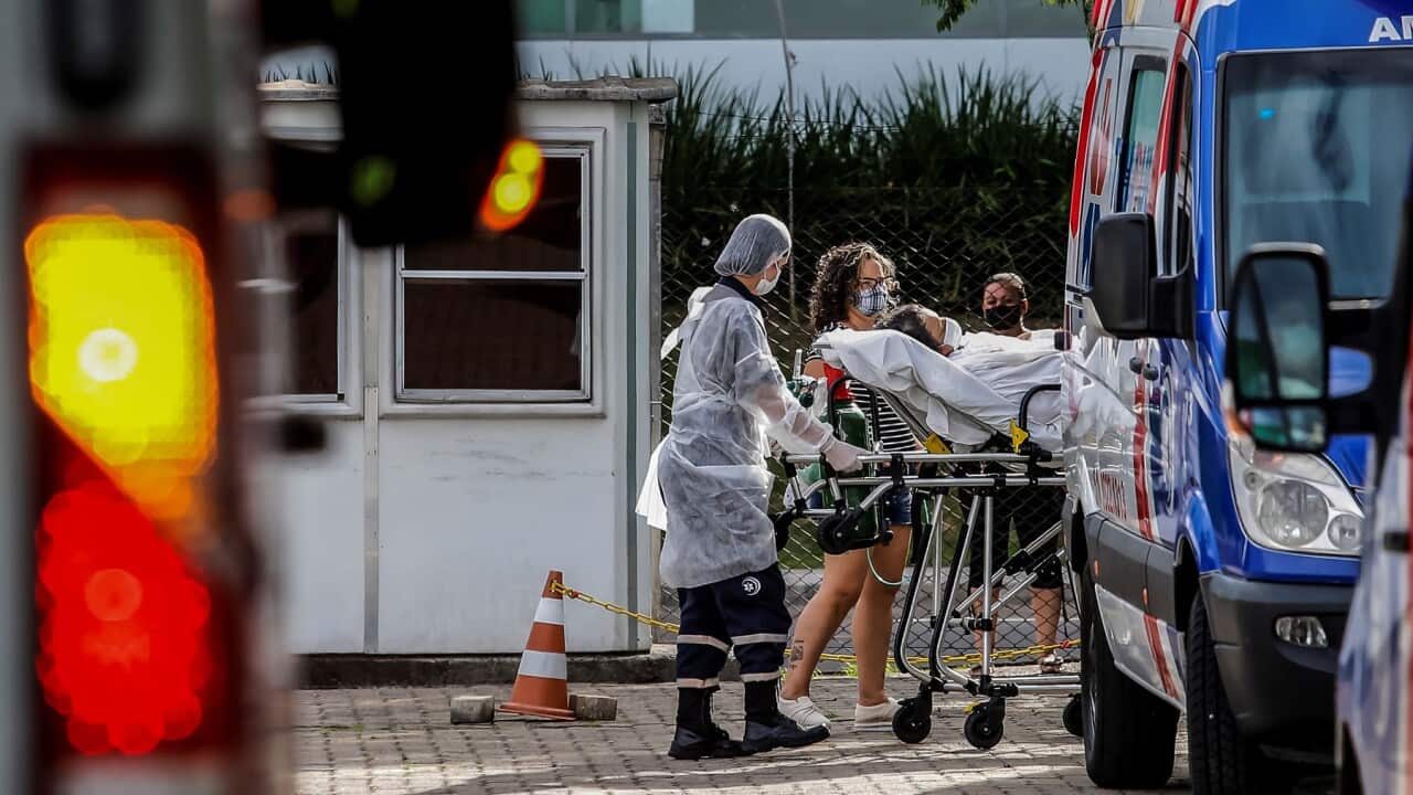 Nurses take a patient into intensive care in Brazil