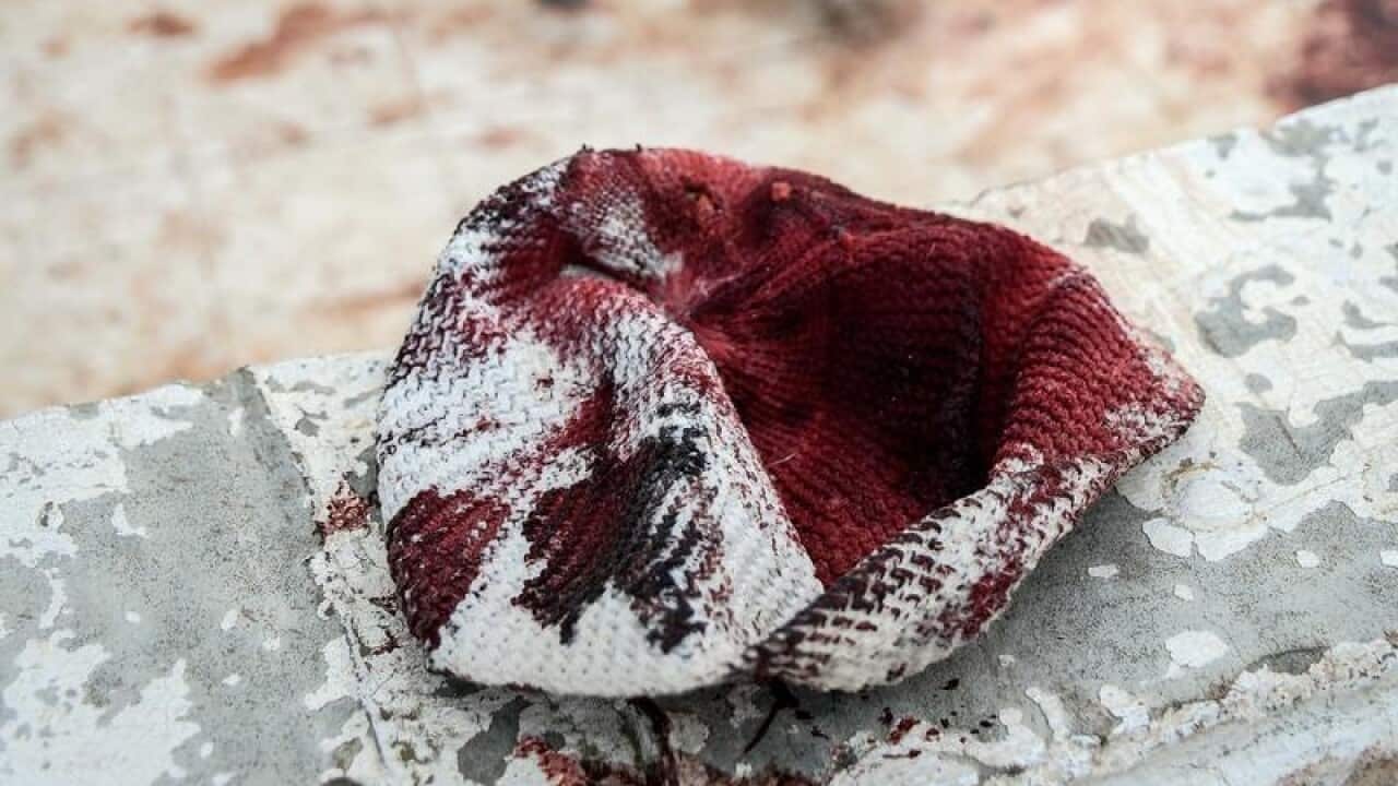 A blood-stained skullcap at a northern Sinai mosque.