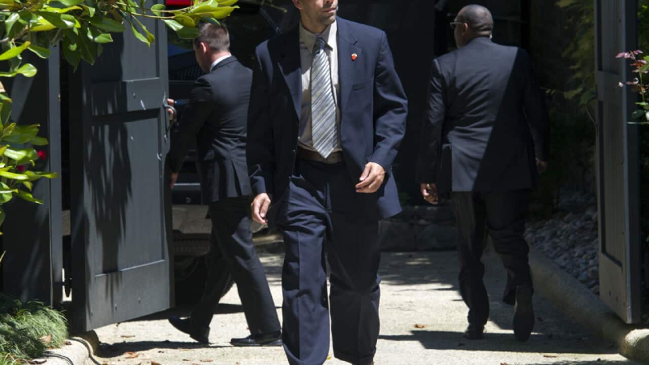 A Secret Service agent stands guard