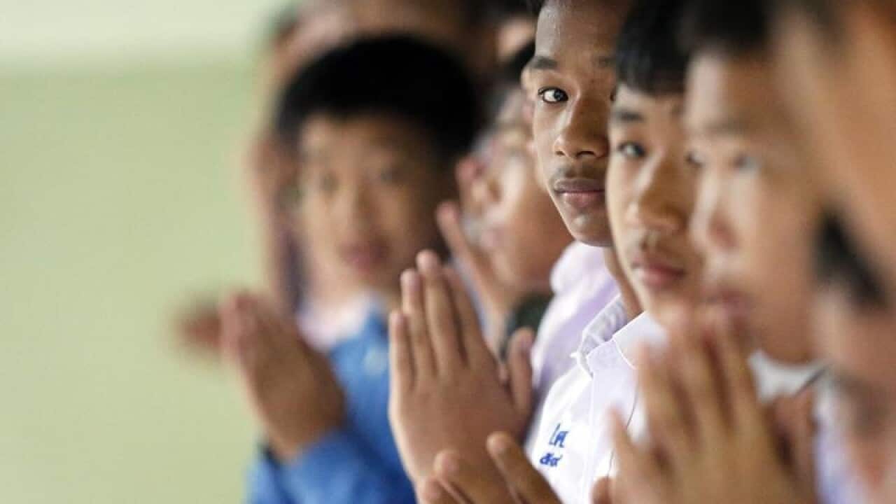 Thai students in Mae Sai pray for their classmates.