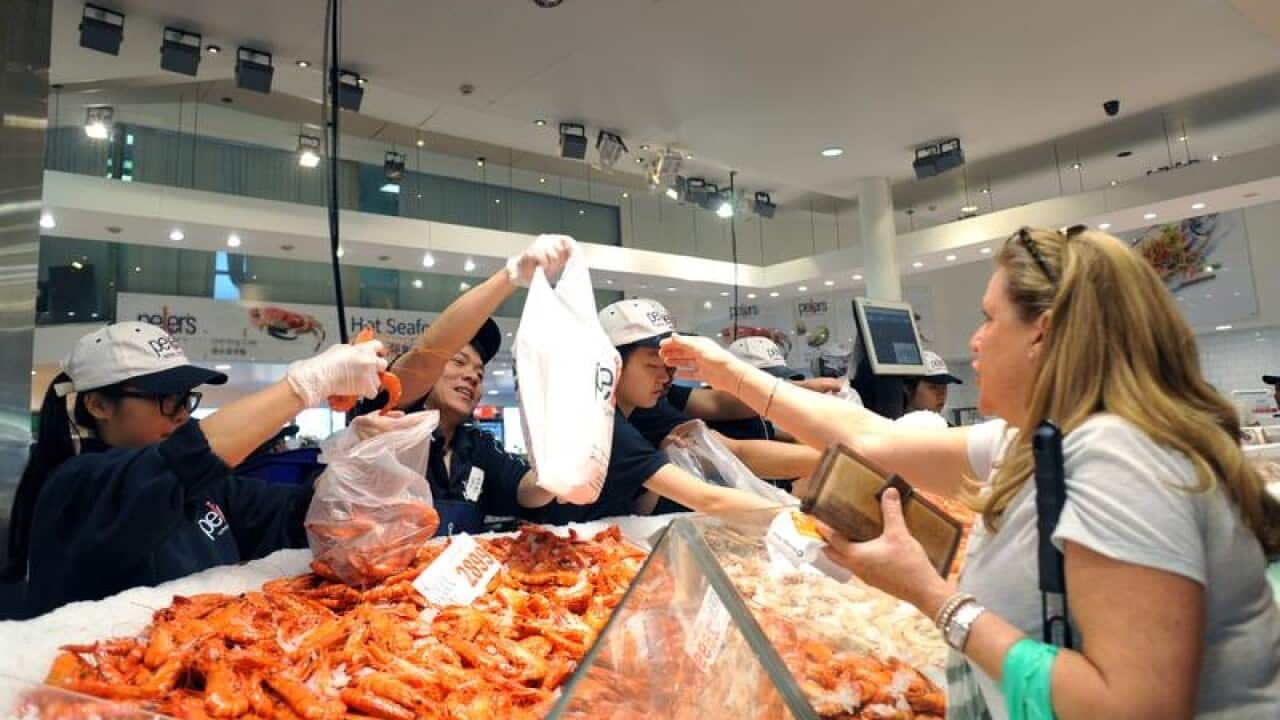 A file image of customers on Good Friday at the Fish Markets.