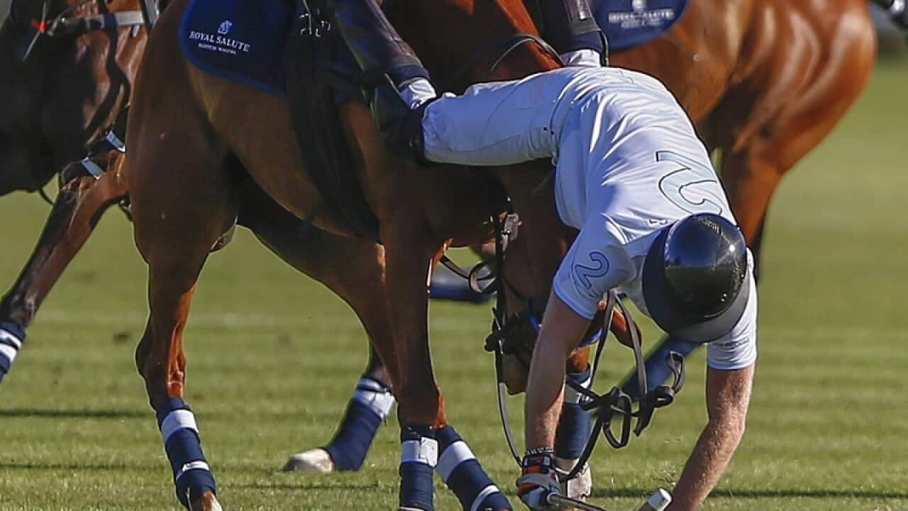 Britain's Prince Harry falls