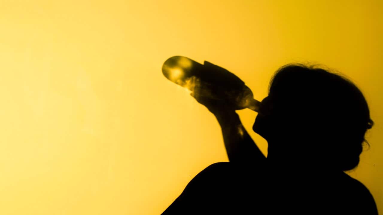 Shadow of an alcoholic woman.