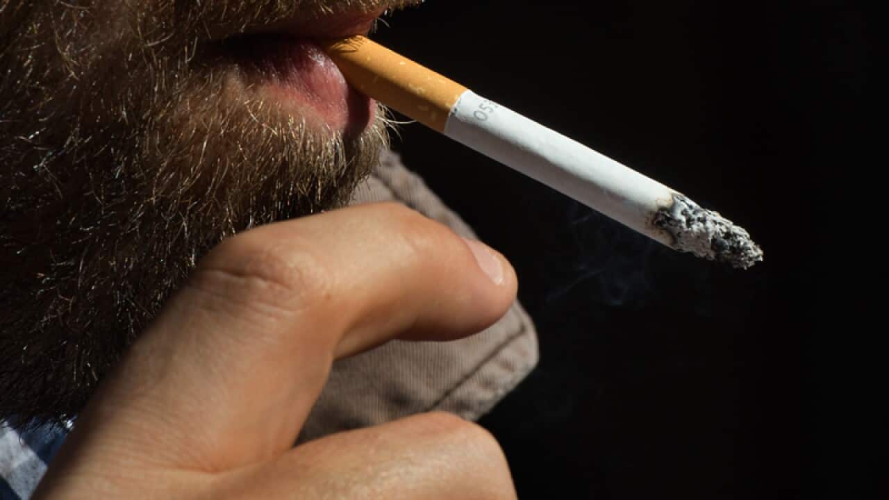 A smoker enjoys a cigarette in Sydney