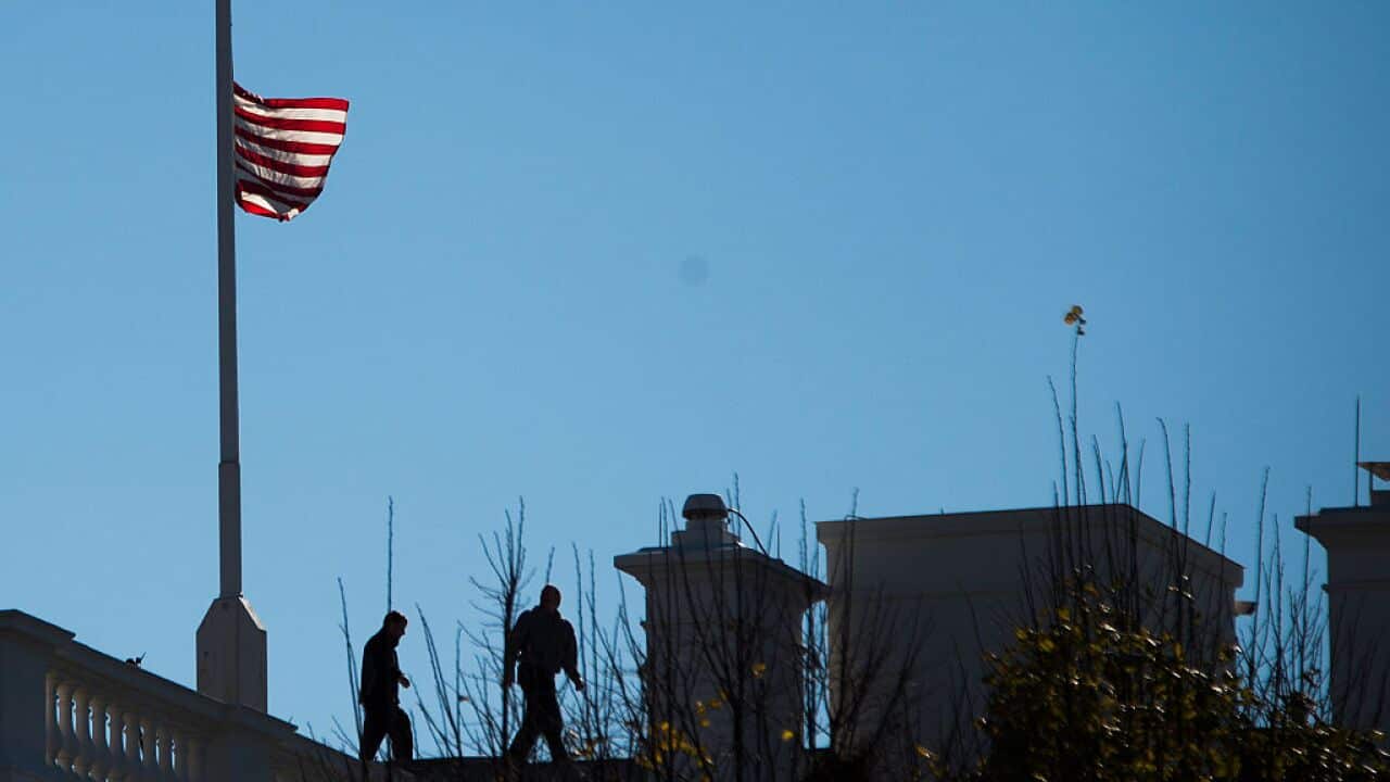 The US flag at the White House is lowered to half mast on December 3, 2015, following US President Barack Obama's statement one day after 14 people were killed in San Bernardino, California. (JIM WATSON/AFP/Getty Images)