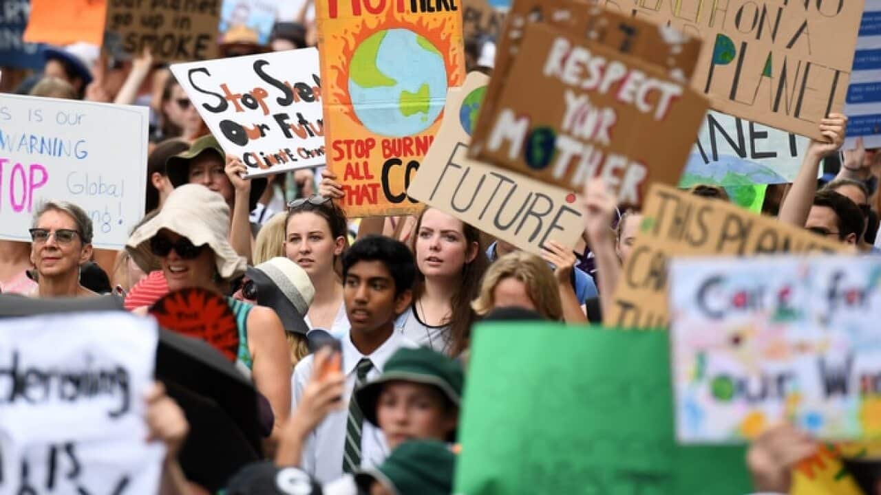 School students take part in a climate change strike in Brisbane.