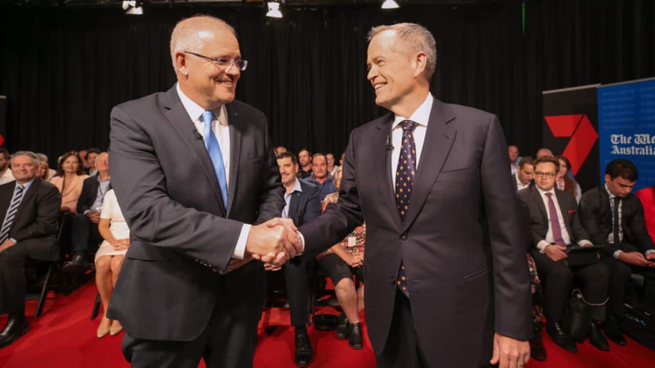 Prime Minister Scott Morrison and Opposition Leader Bill Shorten shake hands before the first leaders debate. (AAP)
