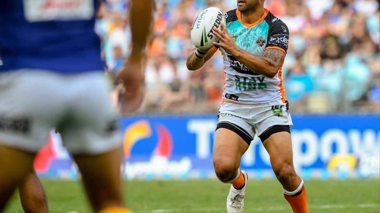Benji Marshall for the Tigers runs with the ball against the Eels