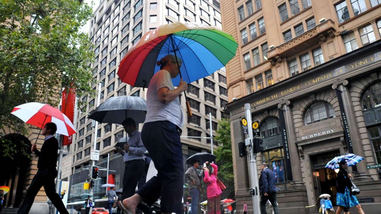 Pedestrians battle wet weather in Sydney's central business district
