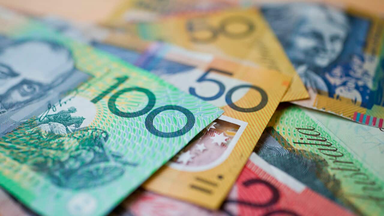 Australian banknotes laid out on a table.