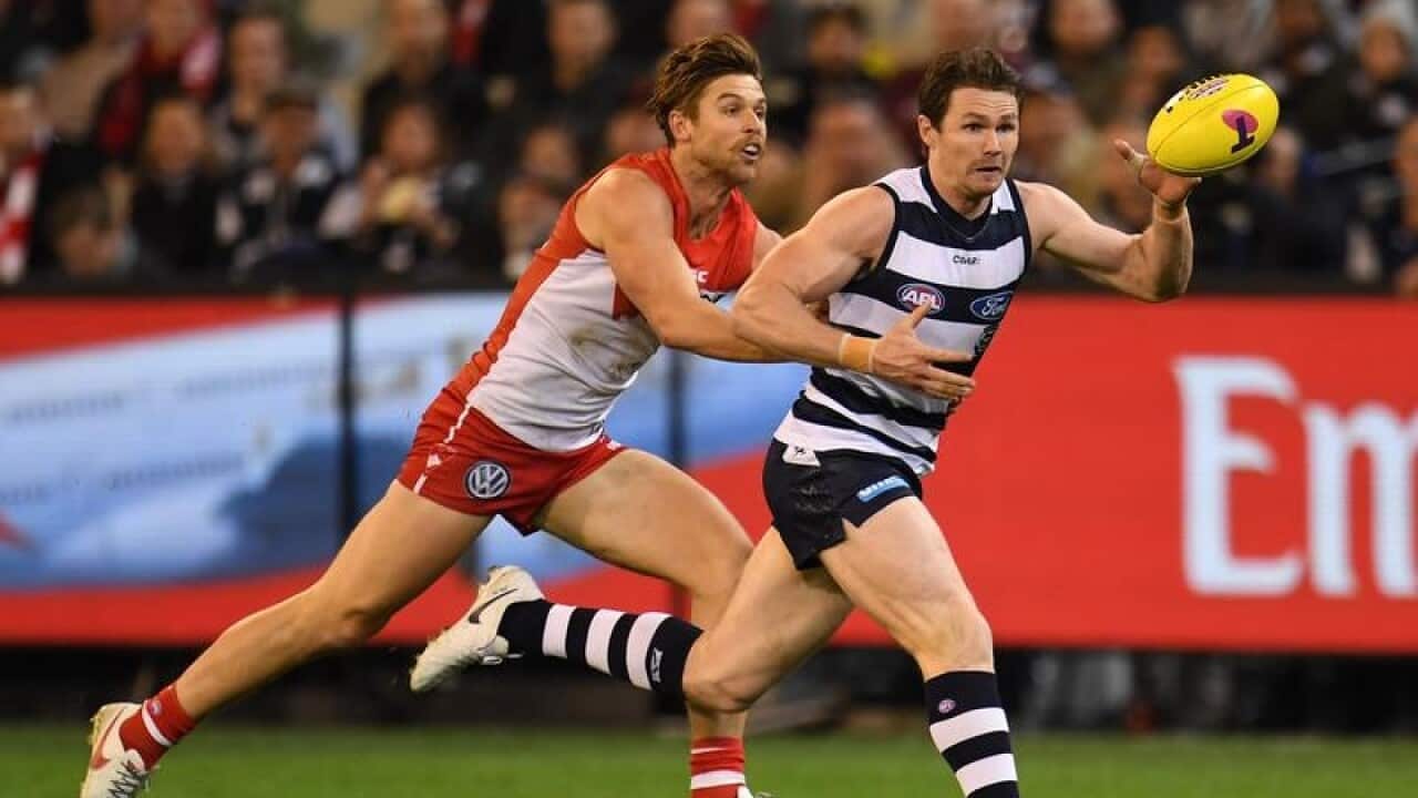 Dane Rampe of the Swans and Patrick Dangerfield the Cats contest.