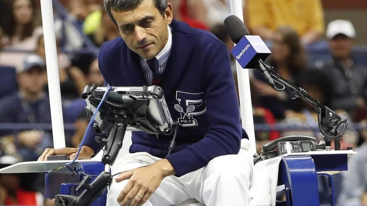 Chair umpire Carlos Ramos talking to Serena Williams