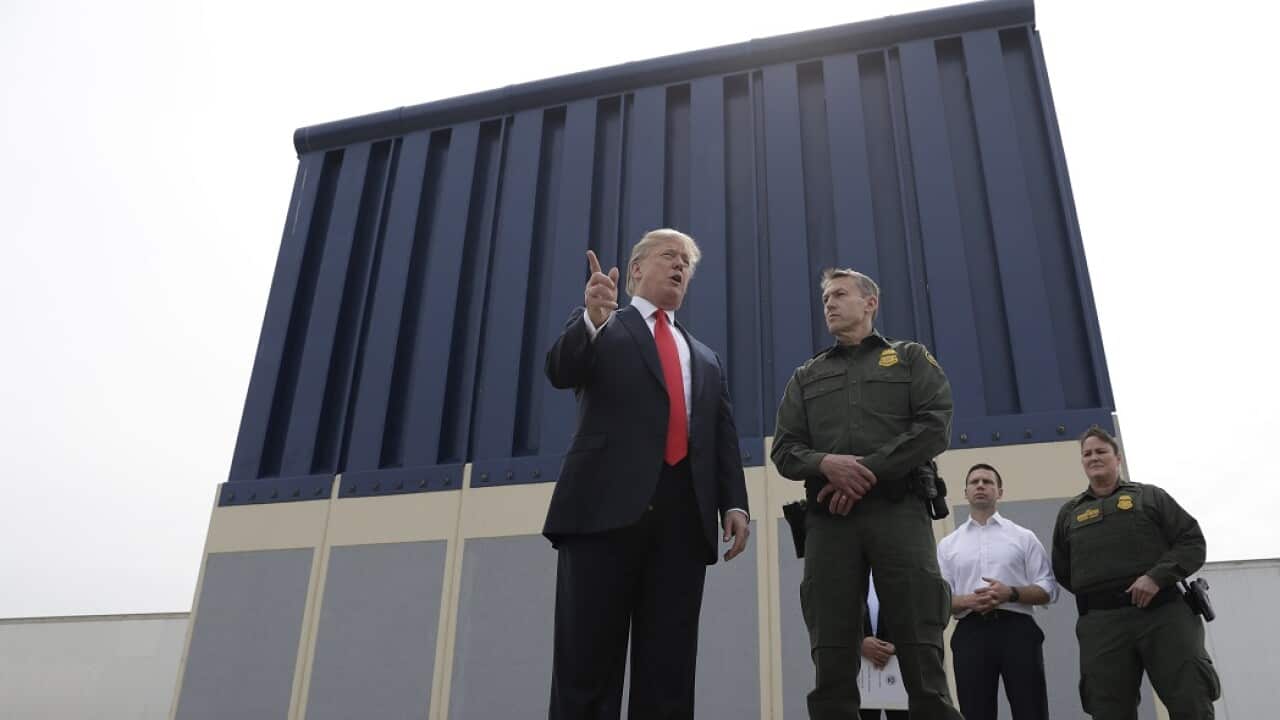 President Donald Trump reviews border wall prototypes, on Tuesday, 13 March, 2018, in San Diego.