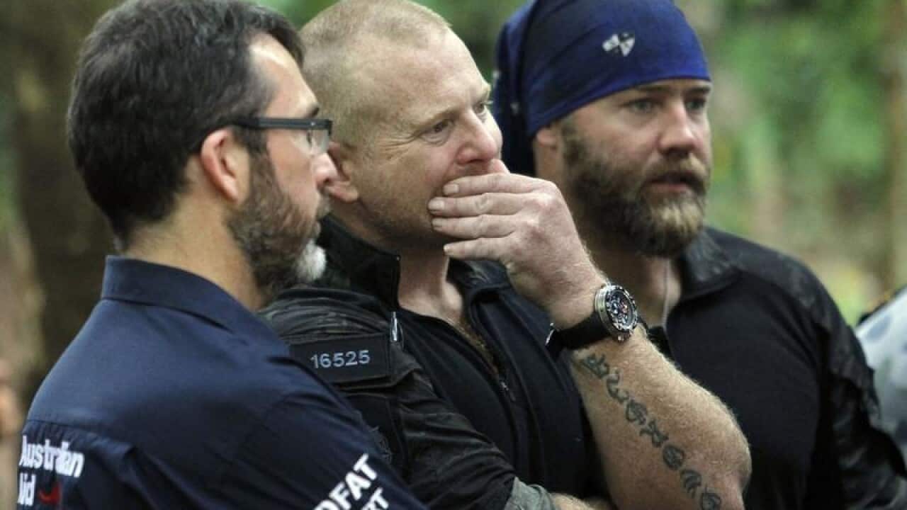 Australian rescuers join search for 13 missing people in Thai cave.