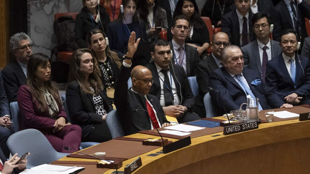 A group of people at a round table meeting.