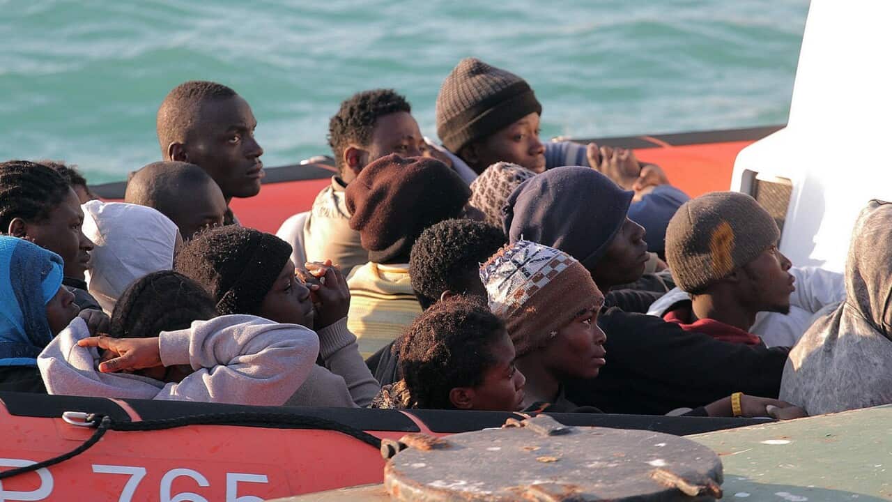 Survivors on a Coast Guard dinghy boat arrive at the Sicilian Porto Empedocle harbor, Italy, Monday, April 13, 2015. (AP Photo/Calogero Montanalampo)