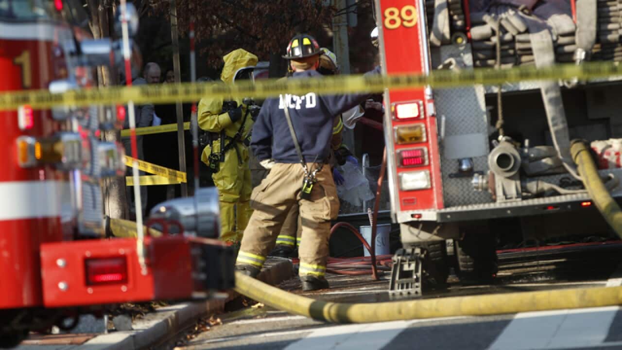 Firefighters and police outside a Muslim advocacy group's headquarters