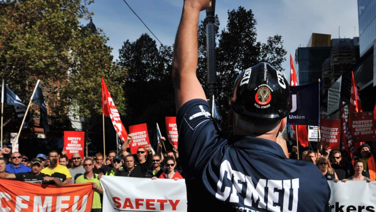construction workers march in the city centre in Melbourne