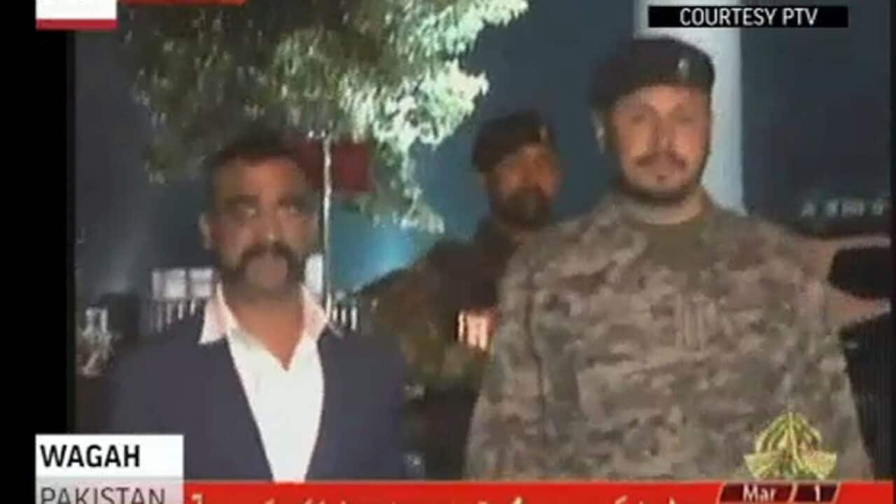 In this image made from video provided by PTV, Wing Commander Abhinandan Varthaman walks to cross the border into India, in Wagah, Pakistan.