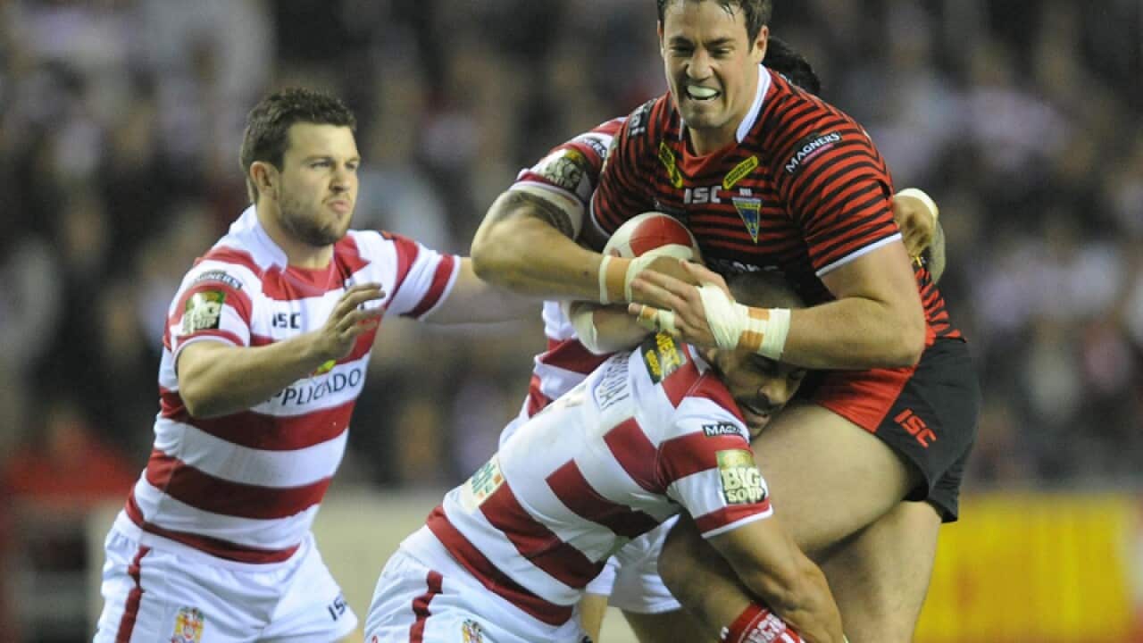 Warrington Wolves' Trent Waterhouse, right