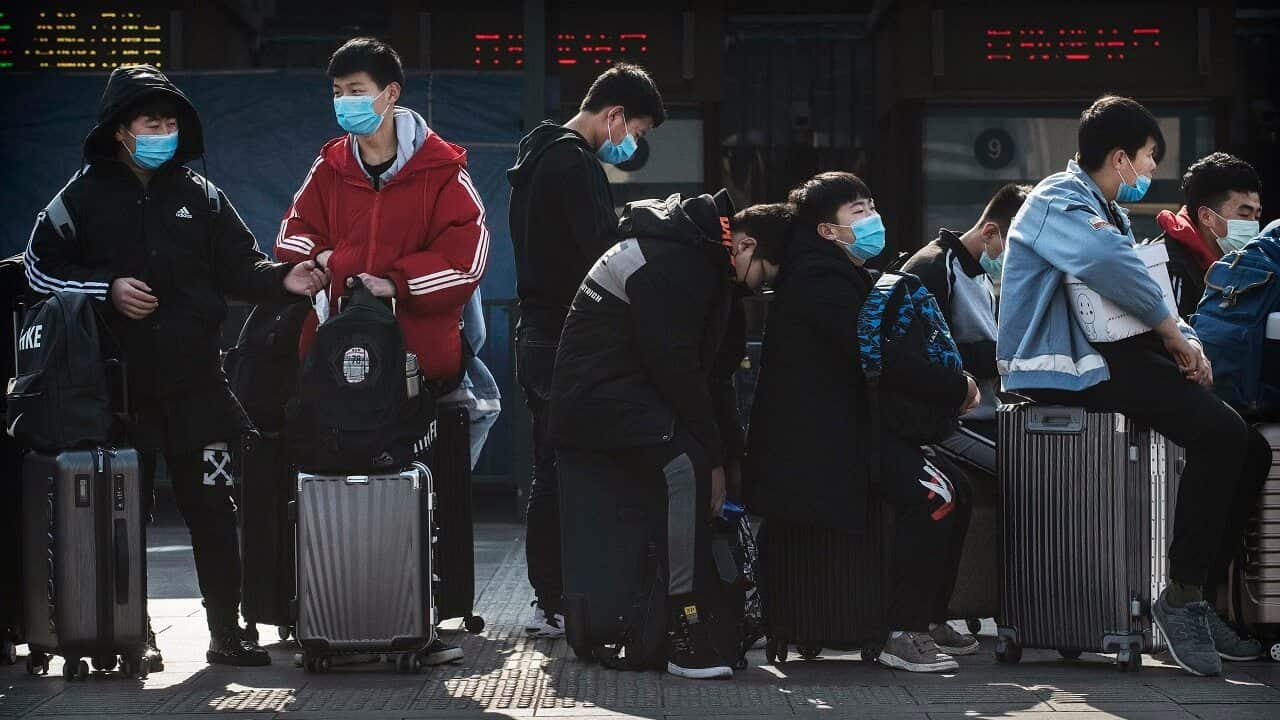 Chinese students wear masks in Beijing.