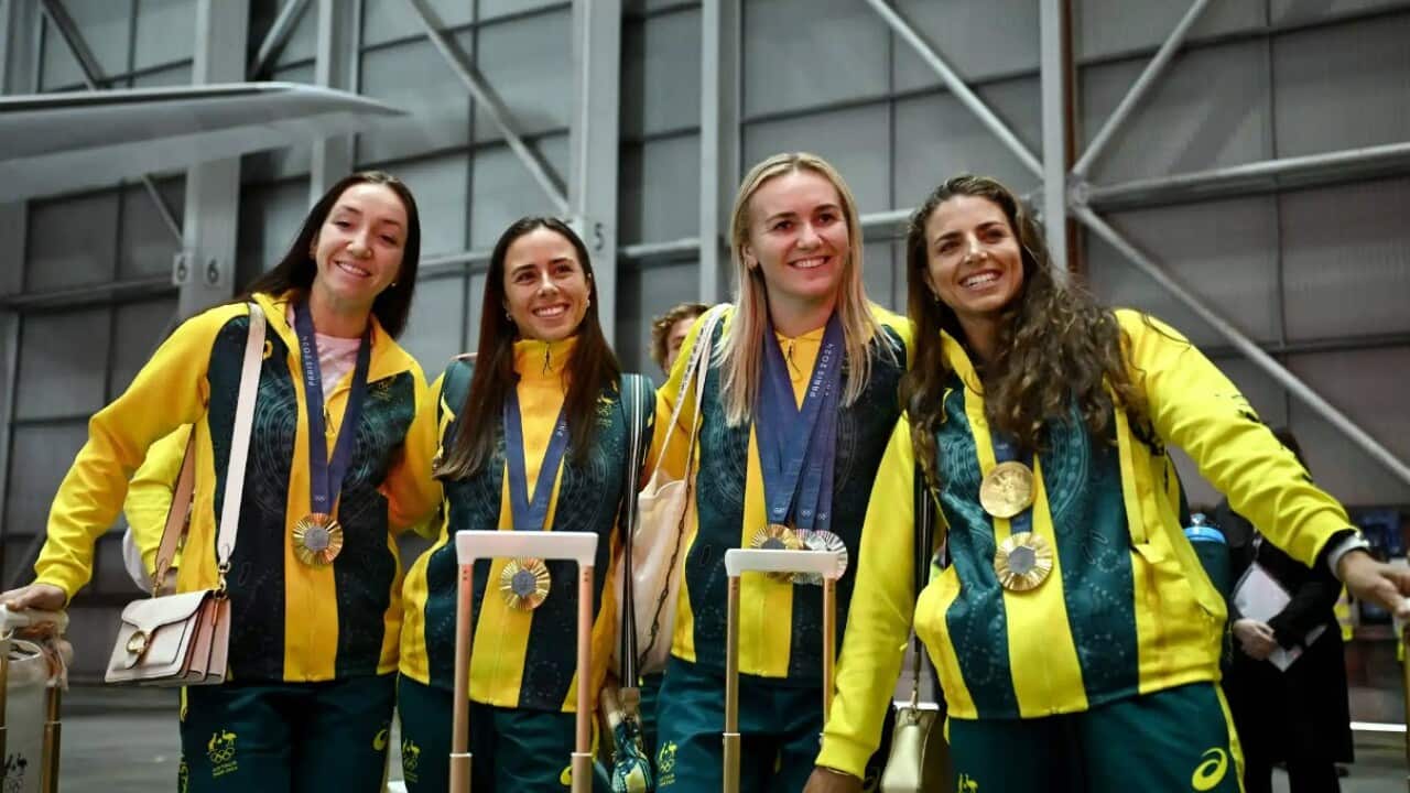 oly oz arrive back AAP.jpg