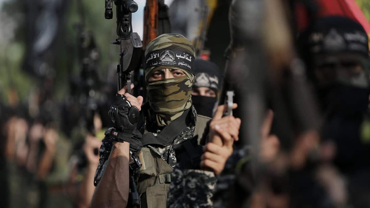 Fighters from al Aqssa martyrs Brigades attend a protest against the security measures at the al-Aqsa mosque in Gaza City.
