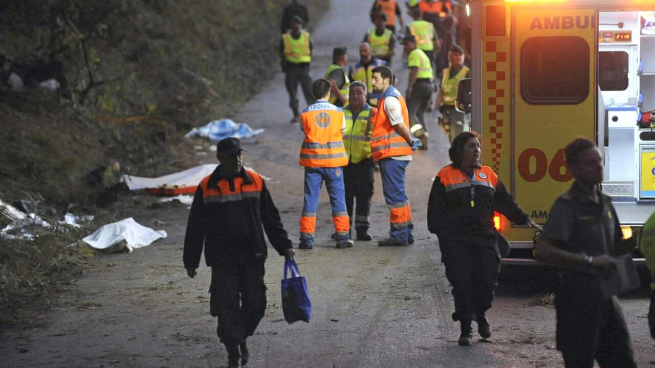 Spanish emergency personnel work at the scene where at least six people died during a rally in A Coruna, northwestern Spain, 05 September 2015. EPA/CABALAR