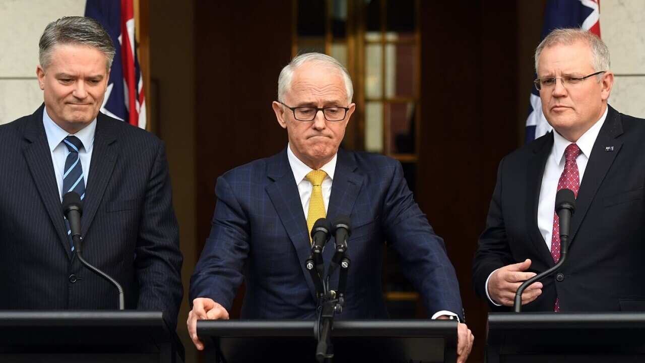 Finance Mathias Cormann (left) and Treasurer Scott Morrison (right) have reaffirmed their support for Malcolm Turnbull. 