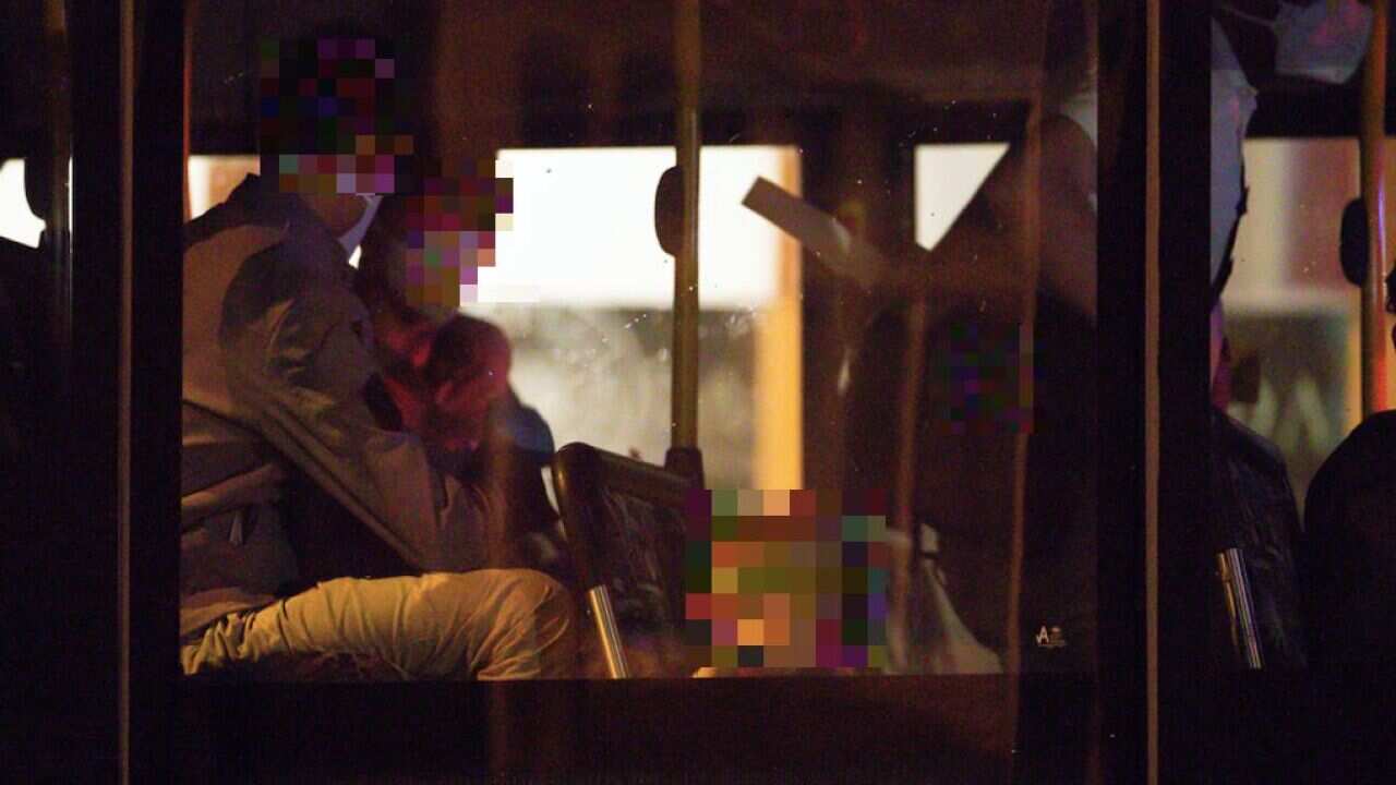 Evacuees from Afghanistan are seen arriving at the Hyatt hotel in Perth, Friday, August 20, 2021