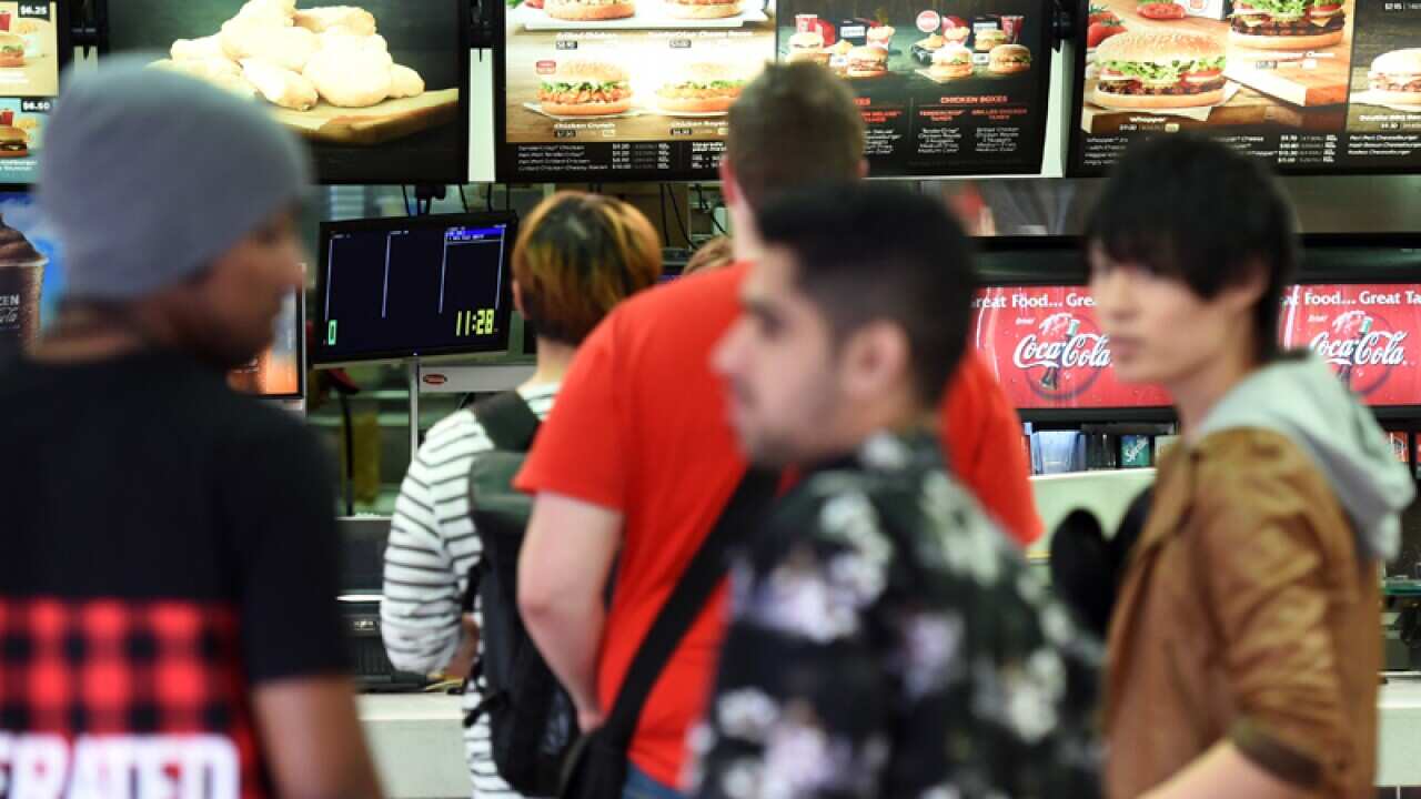 People line up at a fast food restaurant