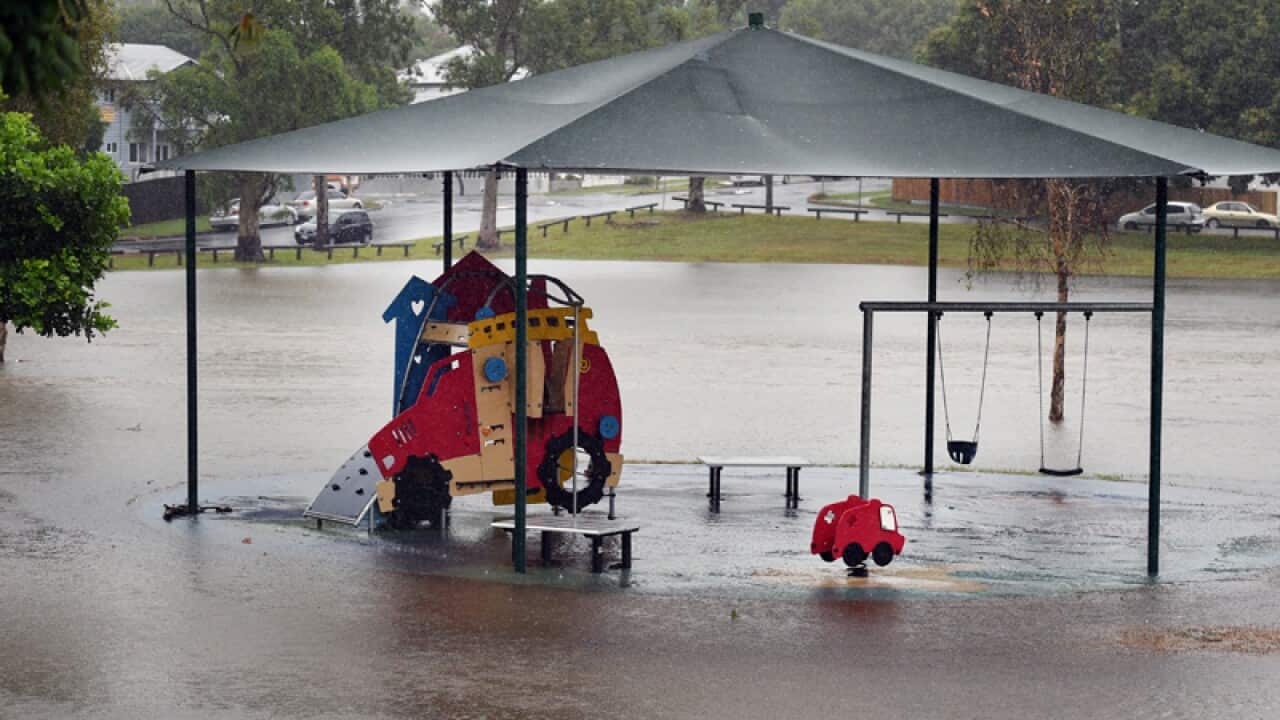 A playground is inundated with flood water in Brisbane