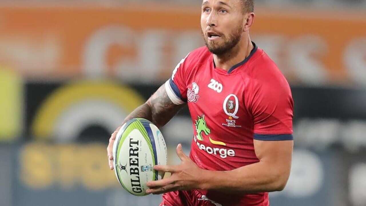 Quade Cooper of the Reds makes a run