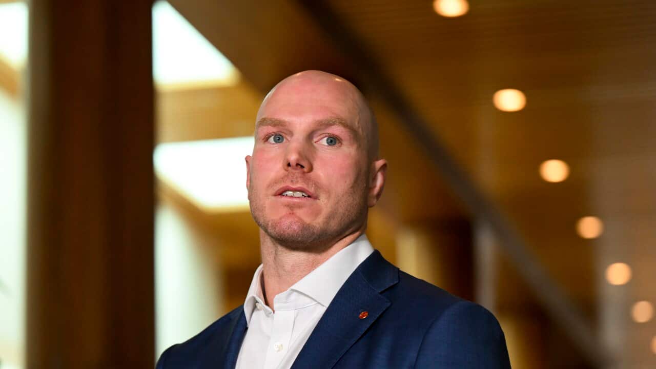 A bald man in a suit