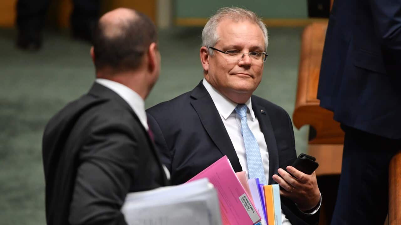 Treasurer Josh Frydenberg and Prime Minister Scott Morrison during Question Time in the House of Representatives at Parliament House.