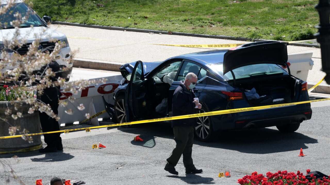 Police investigate the scene after a vehicle charged a barricade at the US Capitol on 2 April.
