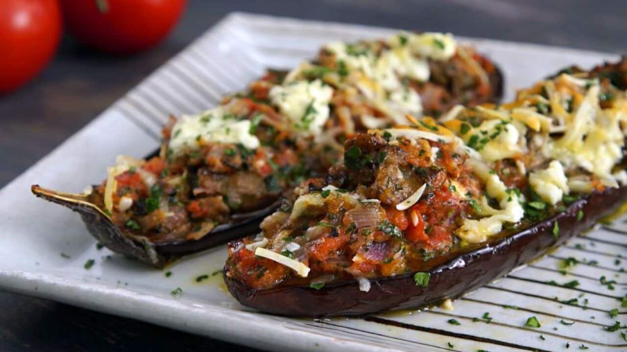 Eggplant halves baked with three cheeses and tomato (‘Little shoes’)