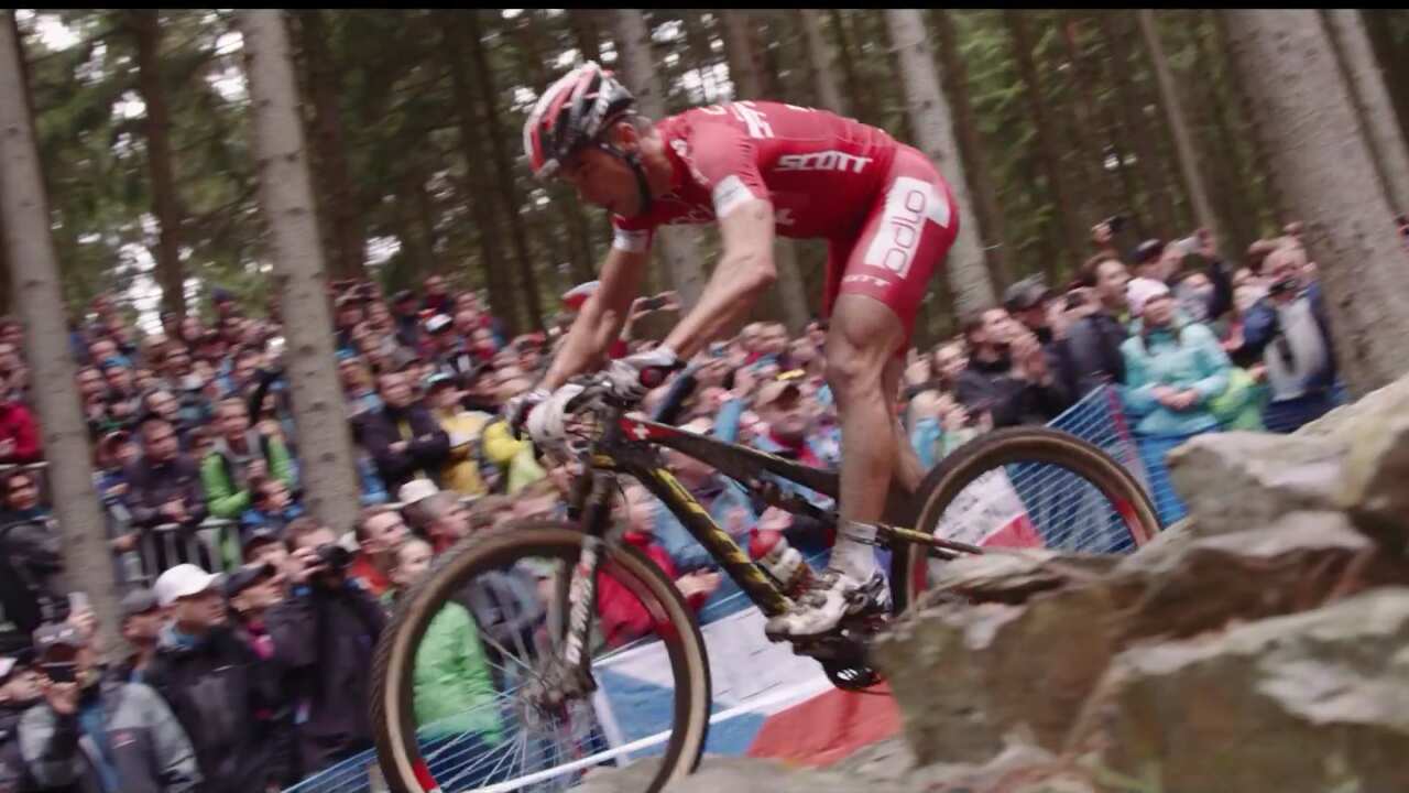 Nino Schurter races through a rock garden at the Nove Mesto UCI MTB World Cup