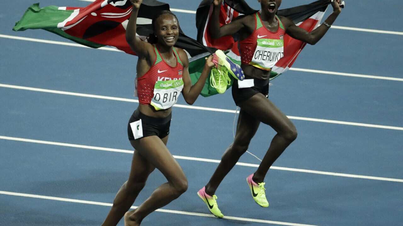 Kenya's Vivian Jepkemoi Cheruiyot (R) and Hellen Onsando Obiri