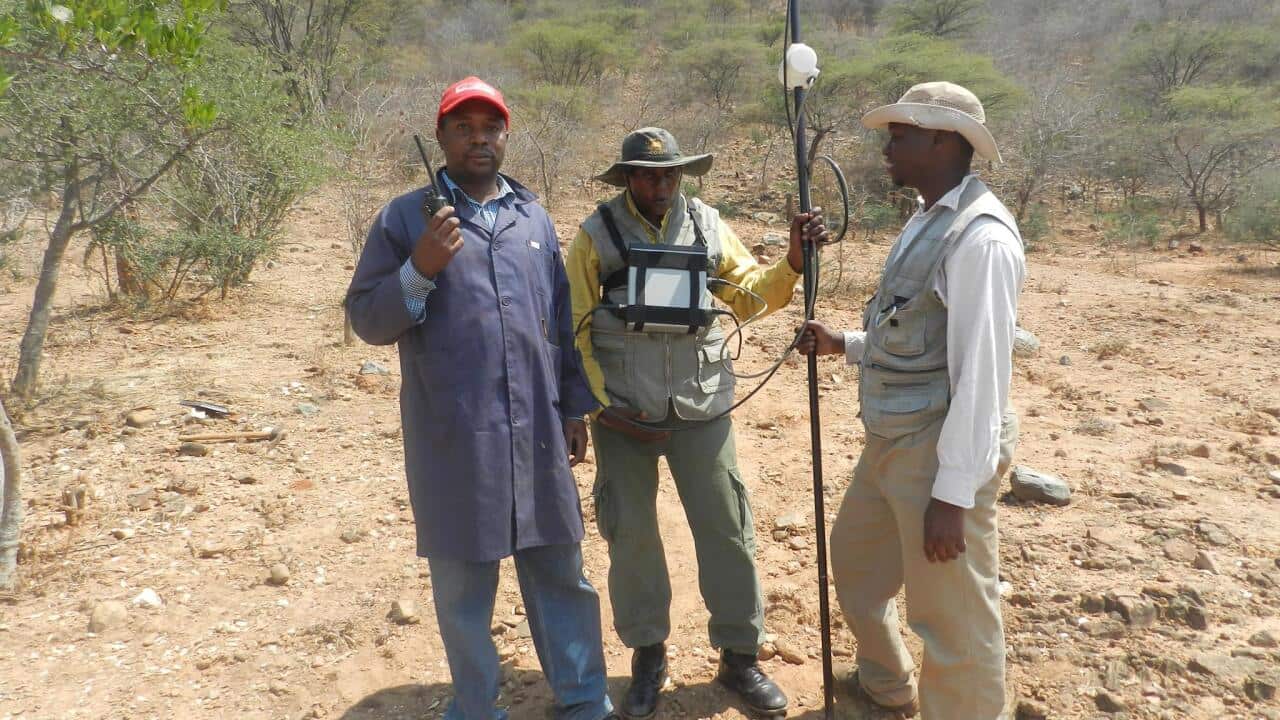 A Geologist Heri Issa Gombera with his team at mining site